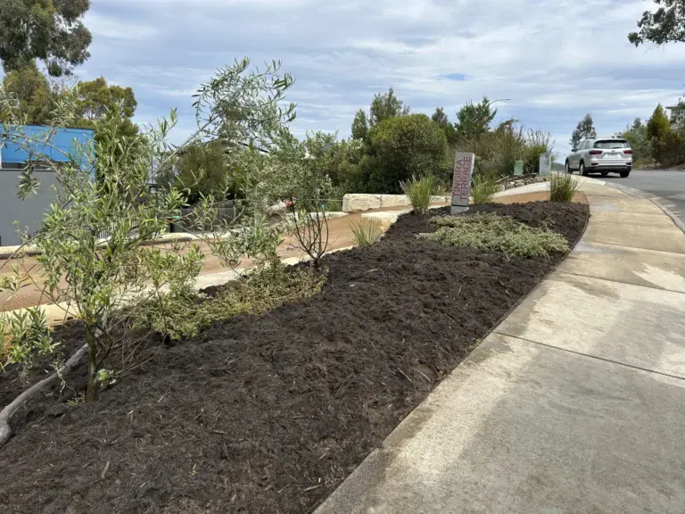 Newly landscaped mulched garden bed and street access at Tingera Terrace, Kingston