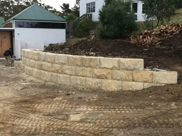 Completed sandstone block retaining wall at a Tinderbox property